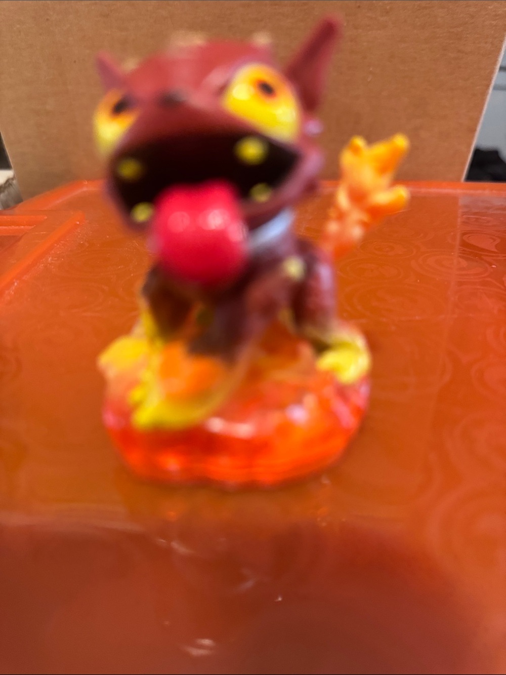Small Red-Orange Fantasy Figurine with Tongue Out.  Skylander